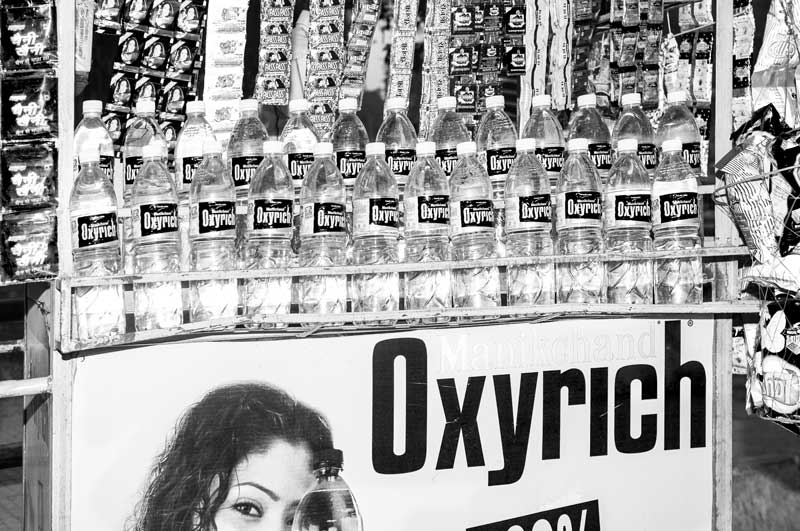 A roadside stall selling bottled water for profit in Central district, National Capital Territory of Delhi